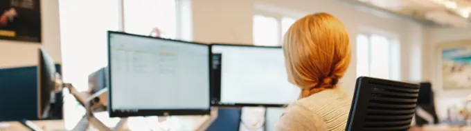 Admissions colleague working behind a desk