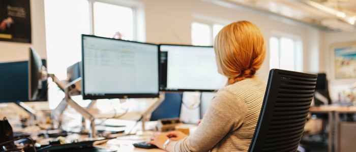 Admissions colleague working behind a desk