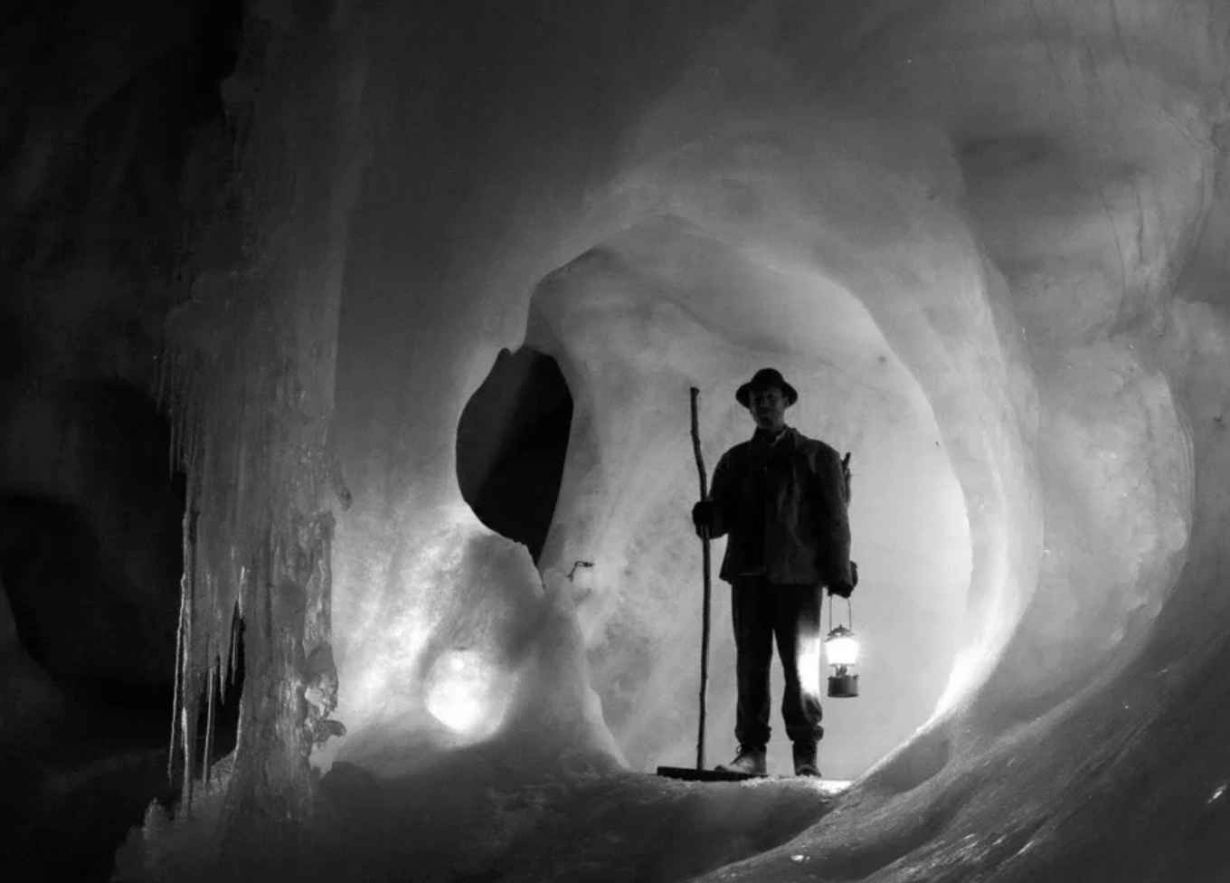 Fiona Tan snapshot from film for exhibition Mountains and Molehill. Solo traveller in a dark cave.