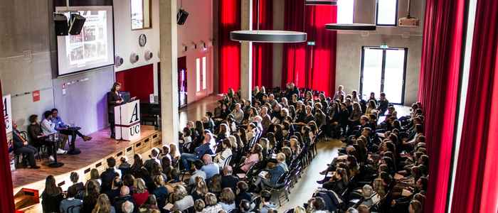 AUC Open Day lecture to a group of prospective students from a stage