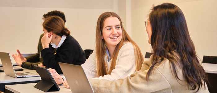 AUC students talking to each other over a computer