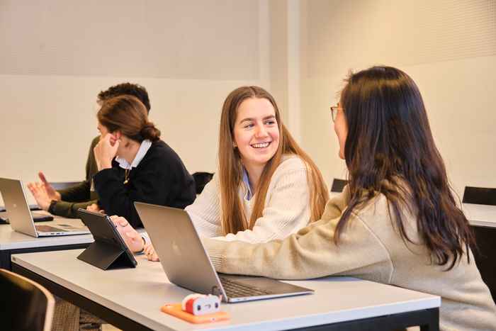 AUC students talking to each other over a computer