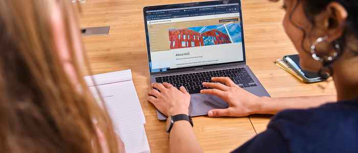 AUC students in a classroom asking a question