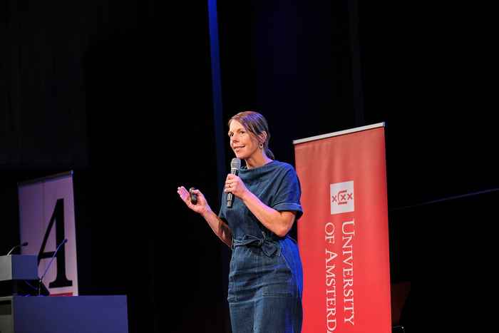 Christa Boer on stage delivering Academic Address facing audience