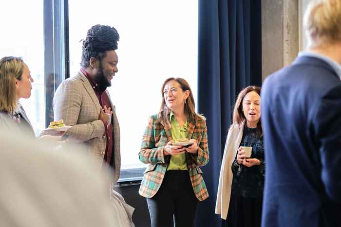 Two participants talking and laughing from a distance